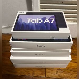 Apple, MacBook Pro, And Samsung Tab A7 Empty Boxes